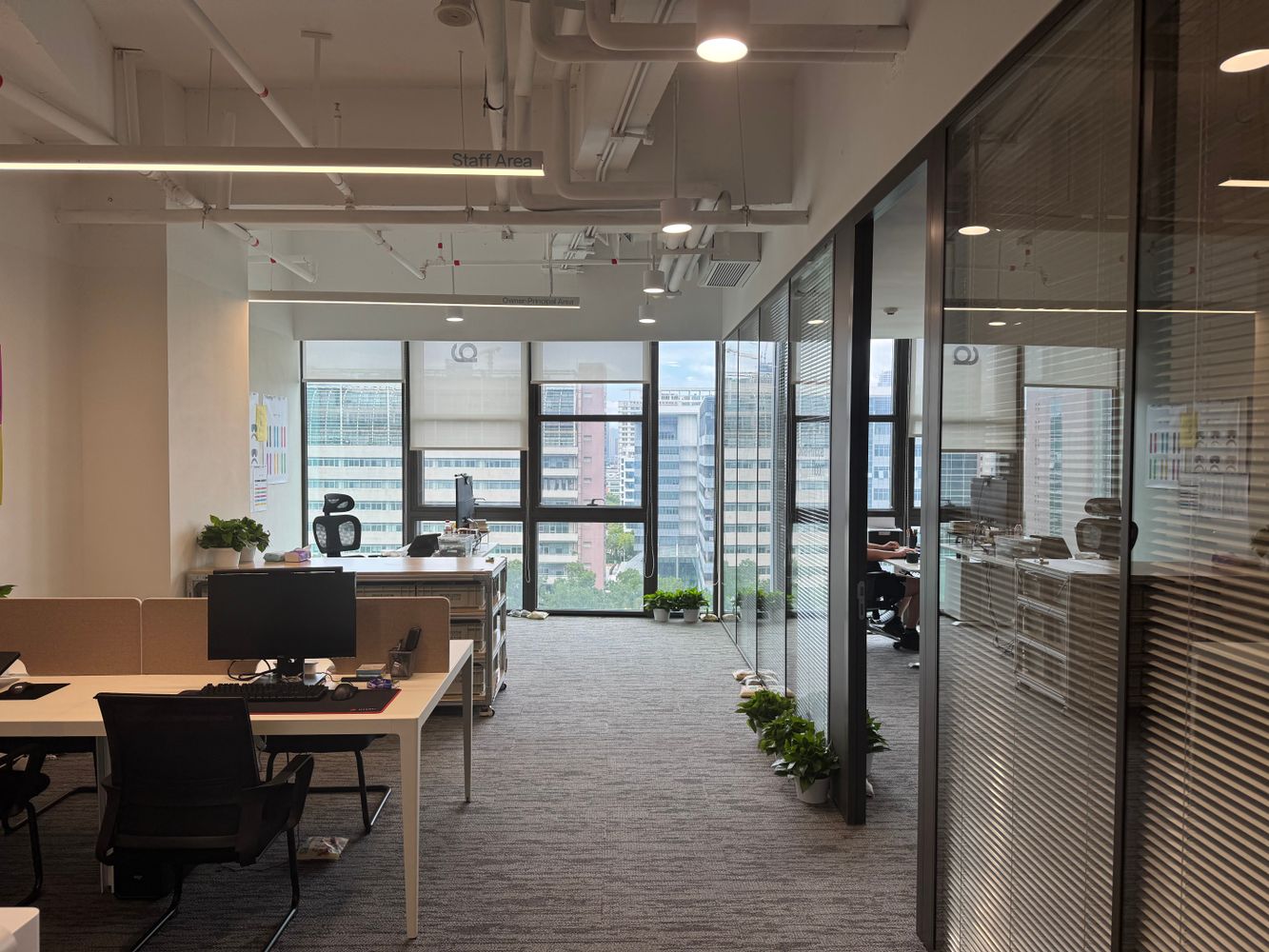 Bright modern commercial office with clean floors and large windows